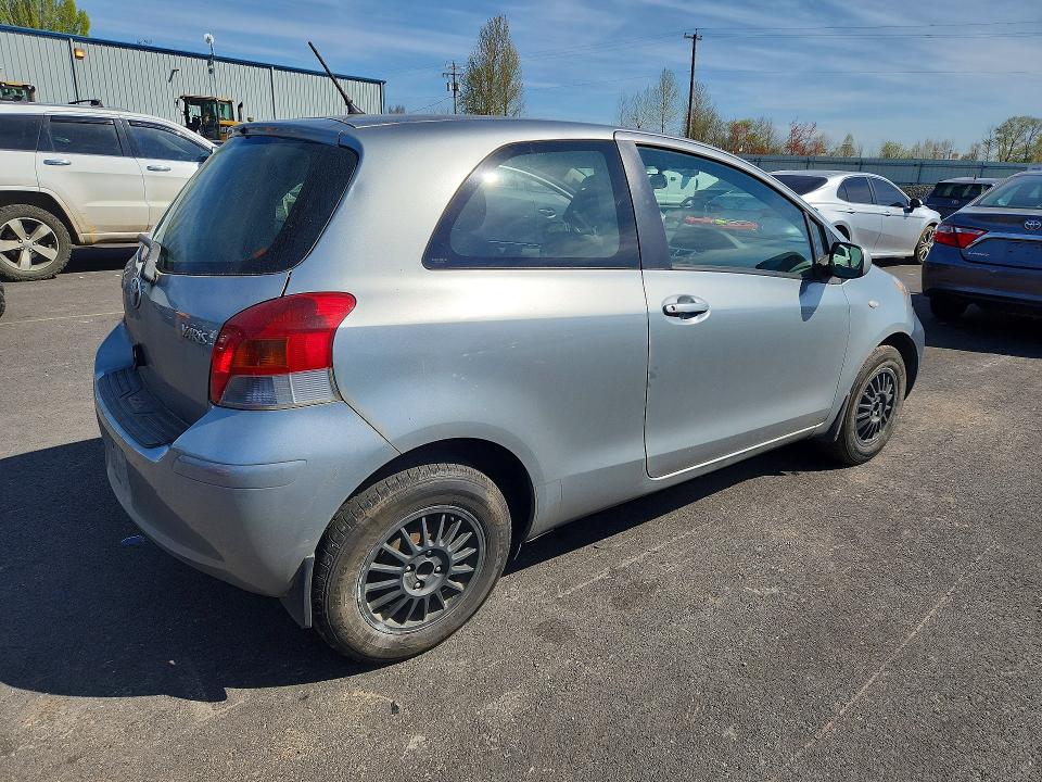 2011 Toyota Yaris VIN JTDJT4K33B5333051 COPART salvage auction — SIDE, Or - Salvage Title Certificate, sold $225 on 2026-07-06 (photo 3)
