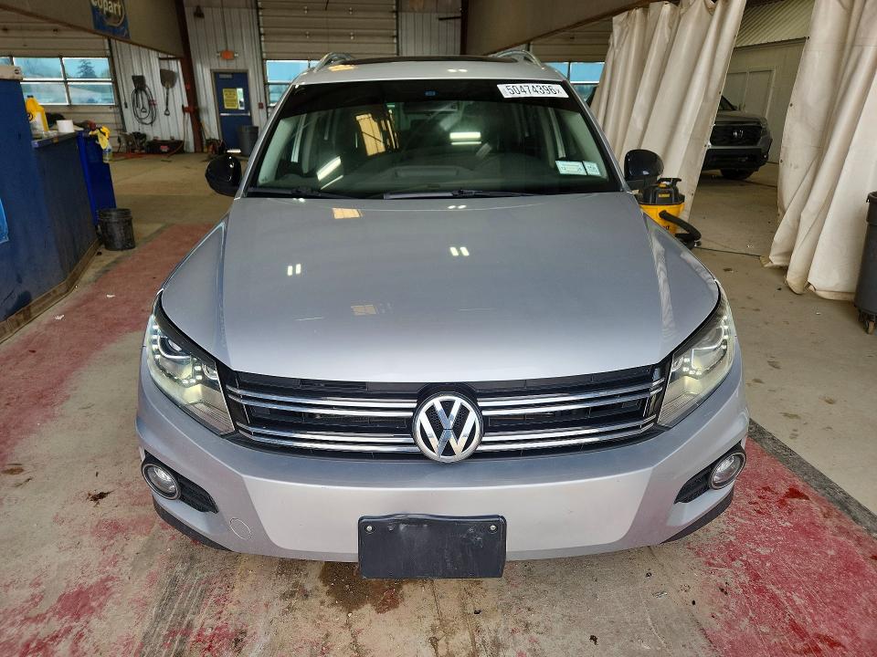 2017 Volkswagen Tiguan VIN WVGTV7AX7HK019420 COPART salvage auction — SIDE, Salvage Title, sold $2,150 on 2026-08-10 (photo 5)