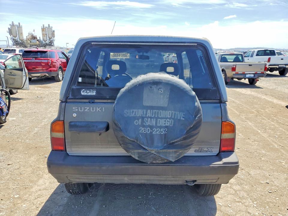 1989 Suzuki Sidekick VIN JS3TA01C5K4112583 COPART salvage auction — MINOR DENT/SCRATCHES, CA - DIS/DLR/EXP ONLY CLEAN TITLE, sold $1,700 on 2026-09-16 (photo 6)