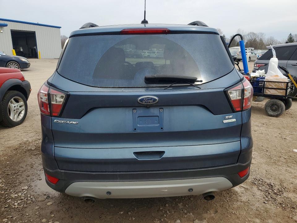 2018 Ford Escape VIN 1FMCU0GD7JUB47786 COPART salvage auction — MINOR DENT/SCRATCHES, Fl - Certificate Of Title, sold $475 on 2026-07-09 (photo 6)