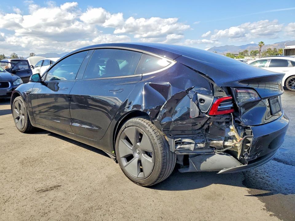 2023 Tesla Model 3 VIN 5YJ3E1EA8PF562228 COPART salvage auction — REAR END, Ca - Salvage Certificate, sold $6,000 on 2026-07-06 (photo 2)