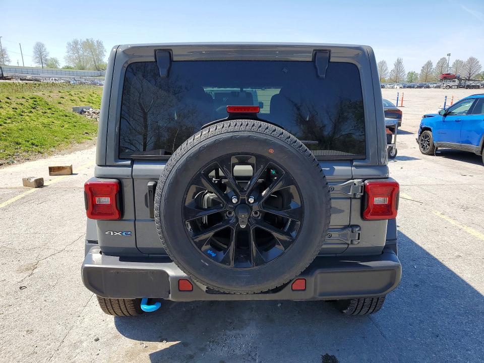 2023 Jeep Wrangler / VIN 1C4JJXP69PW604562 COPART salvage auction — MINOR DENT/SCRATCHES, MO - CERTIFICATE OF TITLE, sold $18,900 on 2026-07-09 (photo 6)