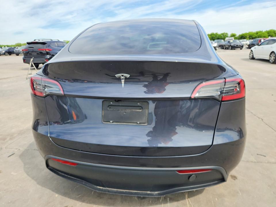 2025 Tesla Model y VIN 7SAYGDED1SA376194 COPART salvage auction — SIDE, Tx - Certificate Of Title, sold $16,100 on 2026-07-16 (photo 6)