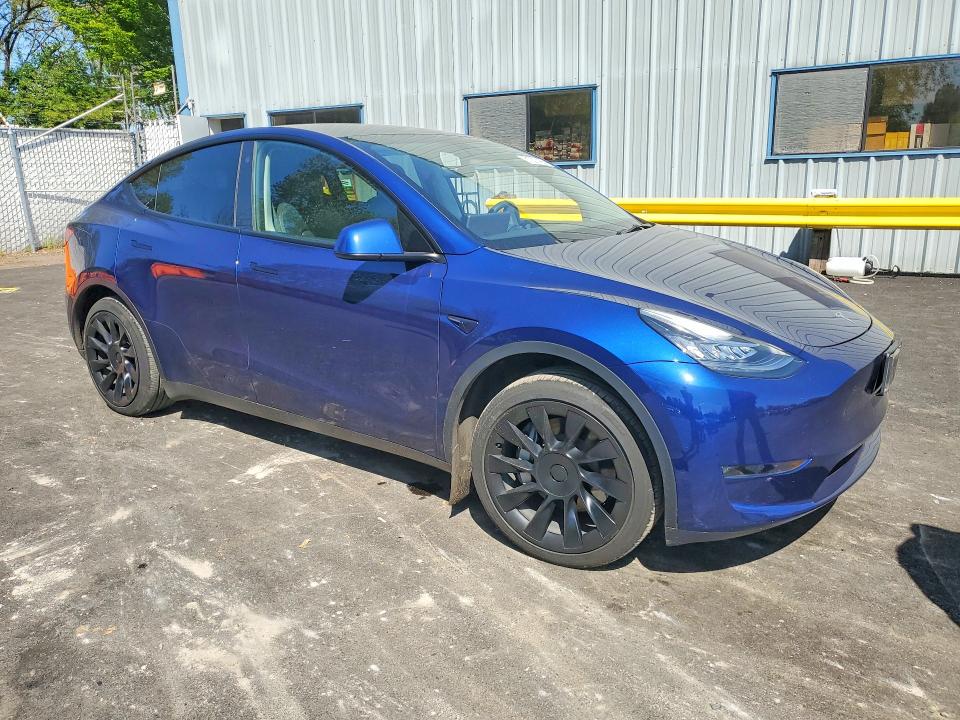 2023 Tesla VIN 7SAYGDEE8PA123454 COPART salvage auction — SIDE, Or - Salvage Title Certificate, sold $13,200 on 2026-07-22 (photo 4)