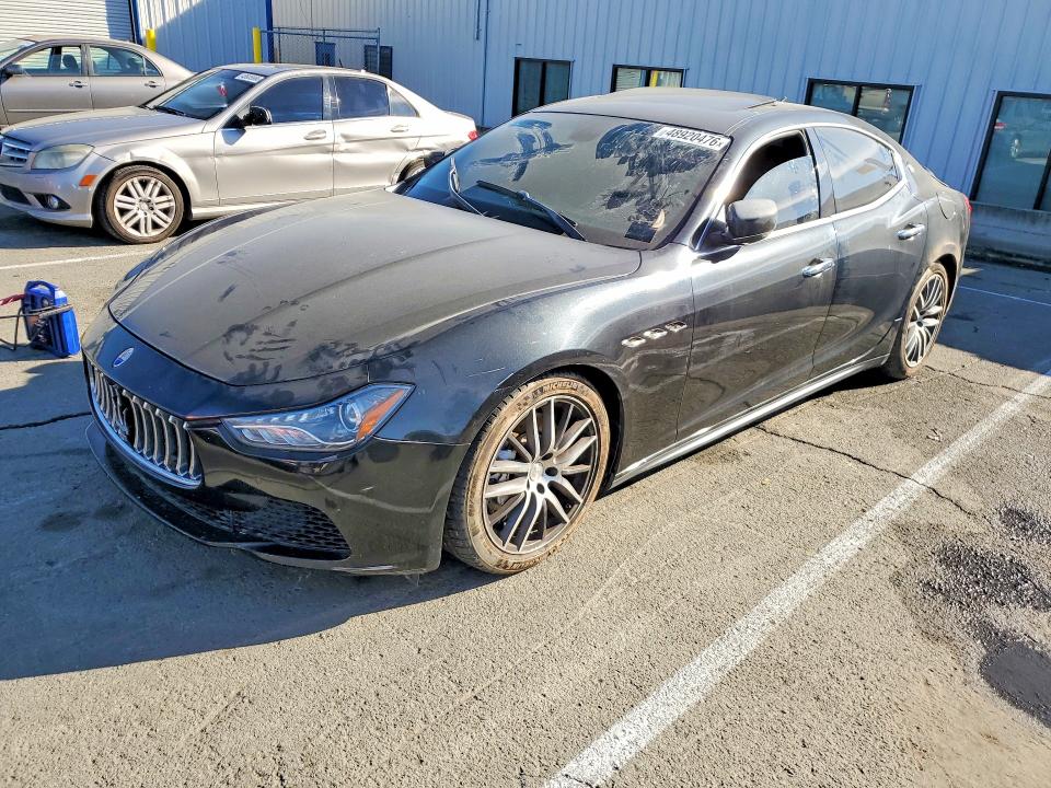 2014 Maserati Ghibli VIN ZAM57RTA9E1085914 COPART salvage auction — SIDE, Fl - Dis/Dlr/Exp Only Clean Title, sold $2,100 on 2026-07-31 (photo 1)