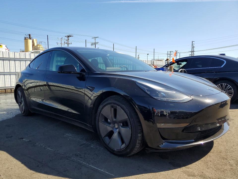 2023 Tesla Model 3 VIN 5YJ3E1EA8PF562228 COPART salvage auction — REAR END, Ca - Salvage Certificate, sold $6,000 on 2026-07-06 (photo 4)