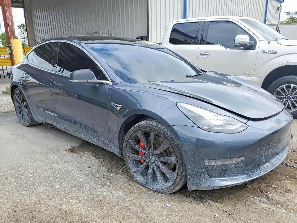 2020 Tesla Model 3 VIN 5YJ3E1EC7LF733742 COPART salvage auction — SIDE, FL, sold $5,000 on 2026-08-28 (photo 4)