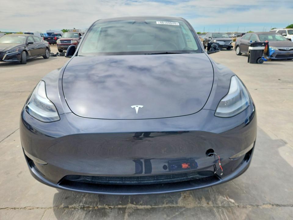 2025 Tesla Model y VIN 7SAYGDED1SA376194 COPART salvage auction — SIDE, Tx - Certificate Of Title, sold $16,100 on 2026-07-16 (photo 5)