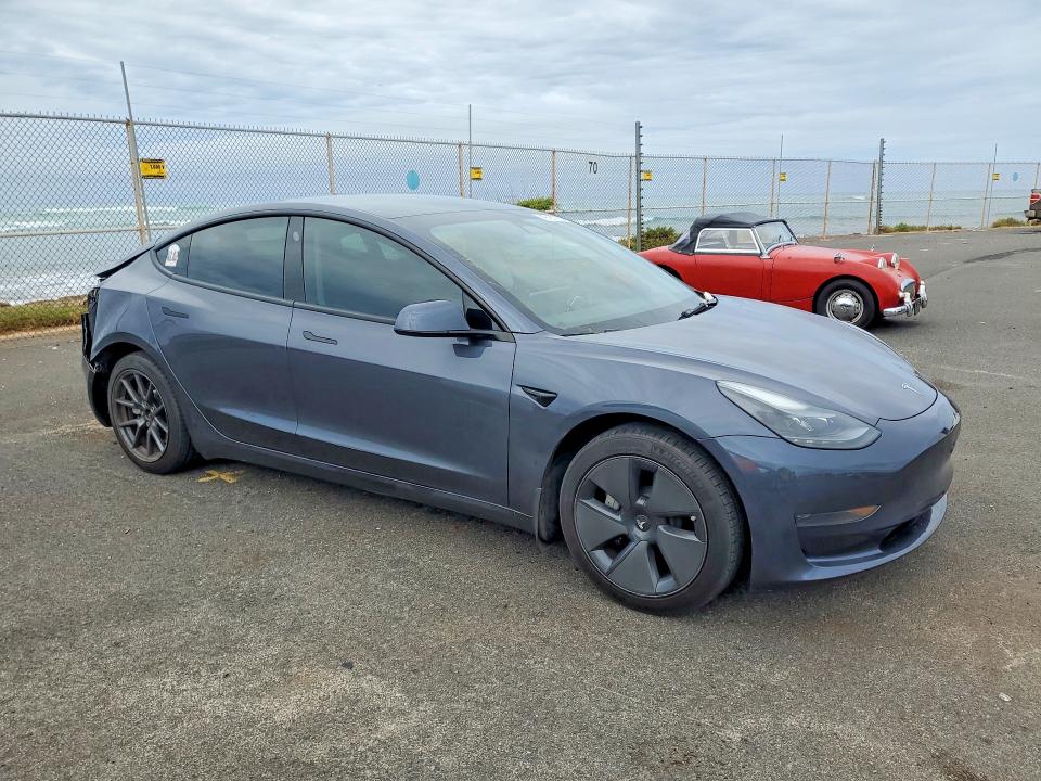 2023 Tesla Model 3 VIN 5YJ3E1EA4PF559438 COPART salvage auction — REAR END, Hi - Certificate Of Salvage, sold $2,150 on 2026-08-31 (photo 4)
