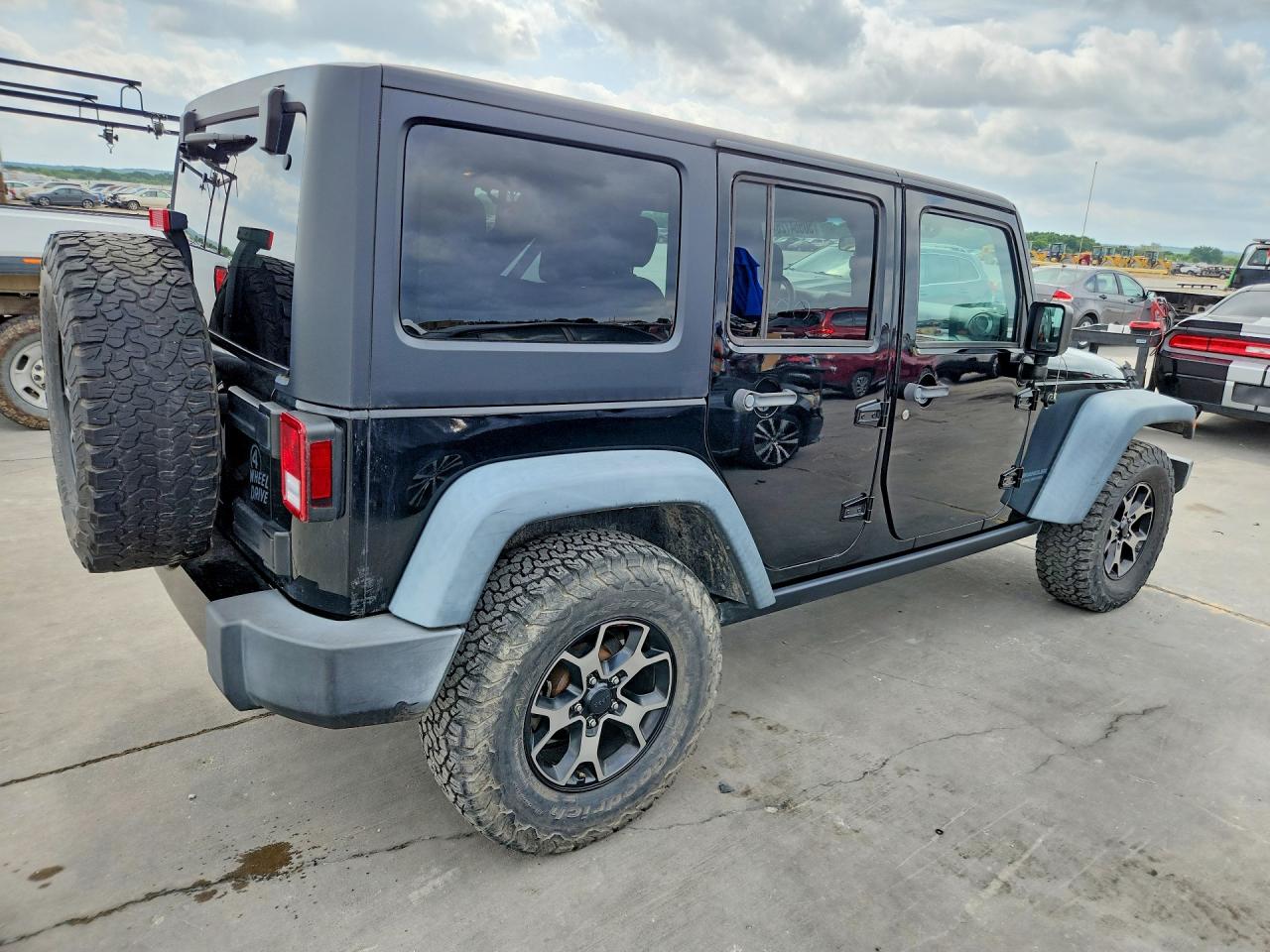2016 Jeep Wrangler Unlimited VIN 1C4BJWDG7GL103053 COPART salvage auction — Normal Wear, TX - CERT OF TITLE-REBLT SLVG FLOOD (P), sold $7,900 on 2026-07-03 (photo 3)