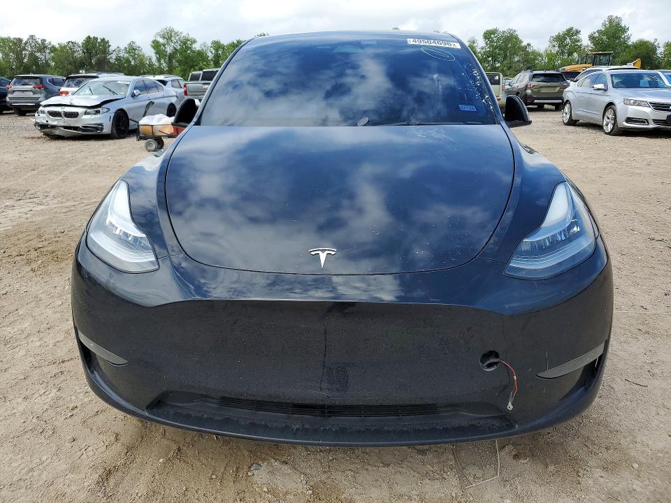 2023 Tesla Model y VIN 7SAYGDEE5PA054822 COPART salvage auction — SIDE, Tx - Salvage Vehicle Title, sold $11,800 on 2026-07-03 (photo 5)