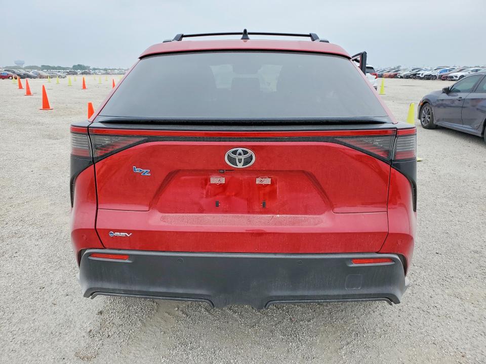 2026 Toyota Bz4x VIN JTMBFAEB1TA004001 COPART salvage auction — SIDE, Tx - Salvage Vehicle Title, sold $6,700 on 2026-07-16 (photo 6)