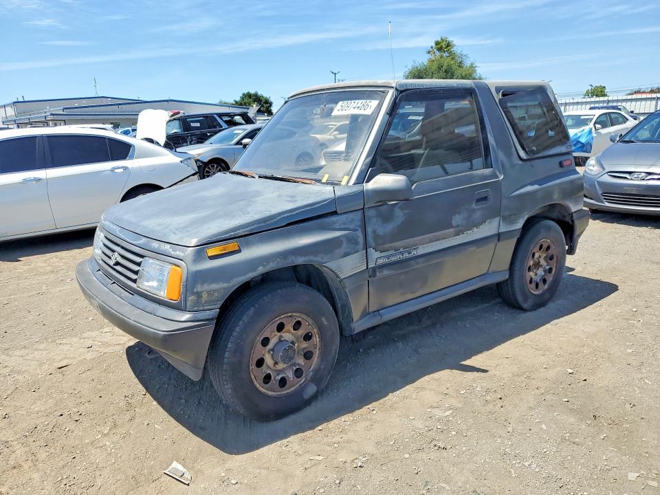 1989 Suzuki Sidekick VIN JS3TA01C5K4112583 COPART salvage auction — MINOR DENT/SCRATCHES, CA - DIS/DLR/EXP ONLY CLEAN TITLE, sold $1,700 on 2026-09-16 (photo 1)