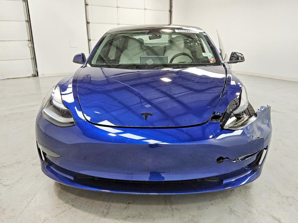 2023 Tesla Model 3 VIN 5YJ3E1EA9PF665190 COPART salvage auction — SIDE, IN - CERTIFICATE OF TITLE, sold $9,000 on 2026-07-23 (photo 5)