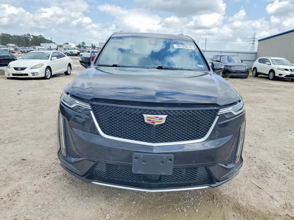 2023 Cadillac Xt6 VIN 1GYKPGRS5PZ135086 COPART salvage auction — WATER/FLOOD, Tx - Salvage Title-Flood Damage, sold $15,400 on 2026-07-14 (photo 5)