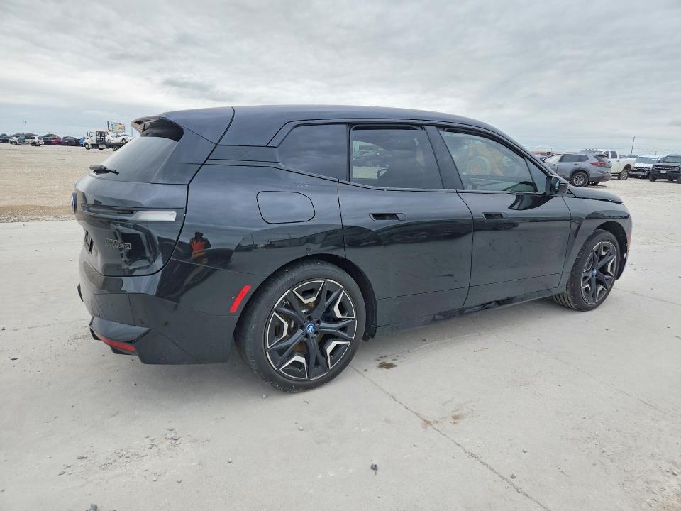 2025 BMW Ix VIN WB533CF00SCT39190 COPART salvage auction — SIDE, Tx - Certificate Of Title, sold $28,250 on 2026-07-28 (photo 3)