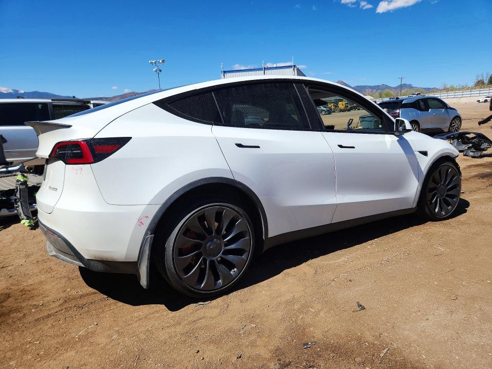 2023 Tesla Model y VIN 7SAYGDEF6PF936786 COPART salvage auction — SIDE, Co - Salvage Title, sold $11,100 on 2026-07-06 (photo 3)