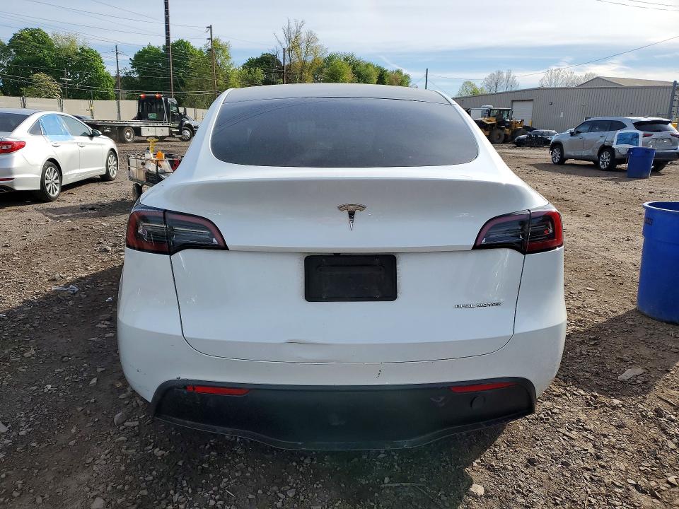 2023 Tesla Model y VIN 7SAYGDEE9PA025095 COPART salvage auction — SIDE, Salvage Title, sold $9,100 on 2026-07-15 (photo 6)