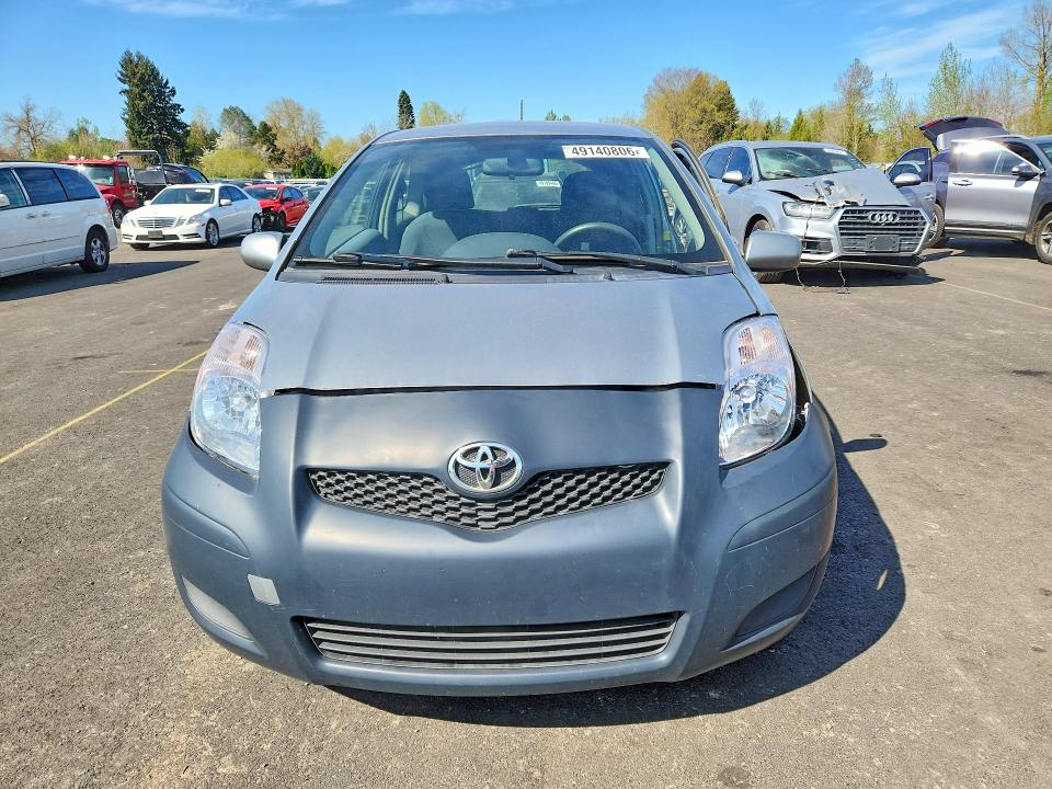 2011 Toyota Yaris VIN JTDJT4K33B5333051 COPART salvage auction — SIDE, Or - Salvage Title Certificate, sold $225 on 2026-07-06 (photo 5)