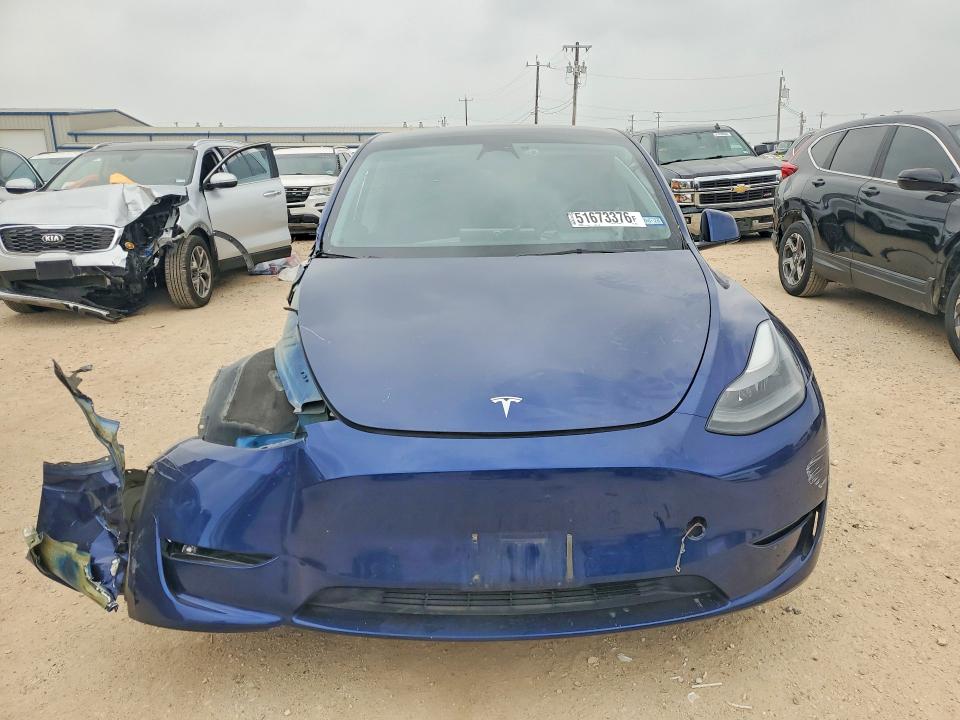 2023 Tesla Model y VIN 7SAYGAEE4PF700515 COPART salvage auction — ALL OVER, Tx - Salvage Vehicle Title, sold $3,350 on 2026-07-16 (photo 5)