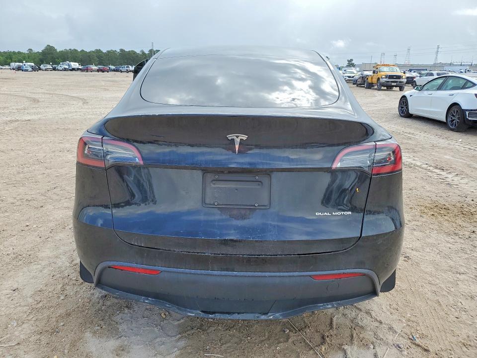 2023 Tesla Model y VIN 7SAYGDEE5PA054822 COPART salvage auction — SIDE, Tx - Salvage Vehicle Title, sold $11,800 on 2026-07-03 (photo 6)