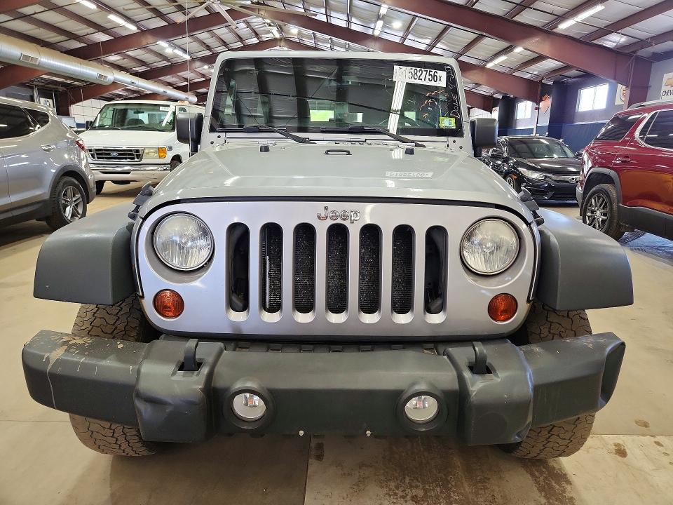 2013 Jeep Wrangler unlimited VIN 1C4BJWDGXDL699433 COPART salvage auction — MINOR DENT/SCRATCHES, Vt - Certificate Of Title, sold $5,900 on 2026-07-02 (photo 5)