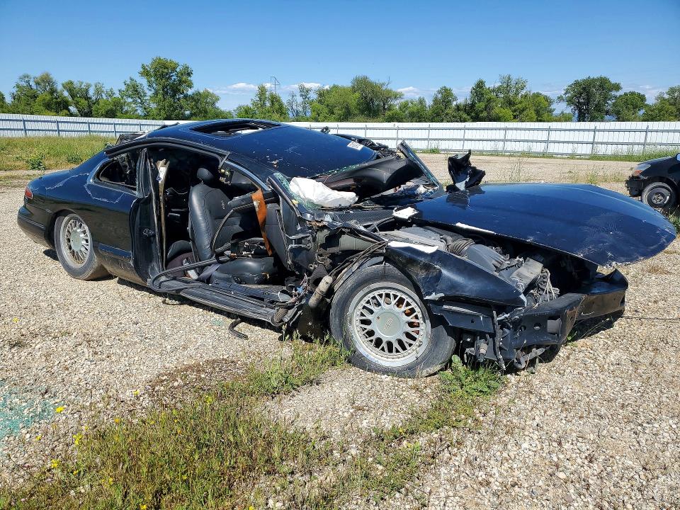 1995 Lincoln Mark series VIN 1LNLM91V4SY760187 COPART salvage auction — ALL OVER, Ca - Dis/Dlr/Exp Lien Papers-Salv, sold $50 on 2026-07-08 (photo 4)