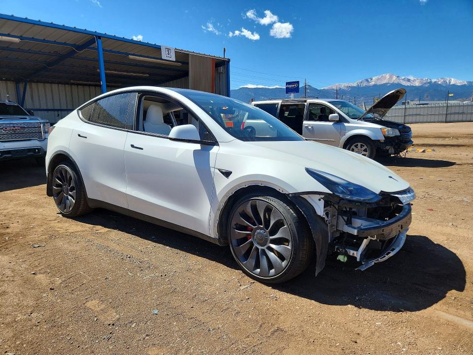 2023 Tesla Model y VIN 7SAYGDEF6PF936786 COPART salvage auction — SIDE, Co - Salvage Title, sold $11,100 on 2026-07-06 (photo 4)