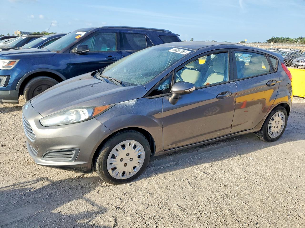 2014 Ford Fiesta VIN 3FADP4EE6EM216034 — COPART salvage auction photo