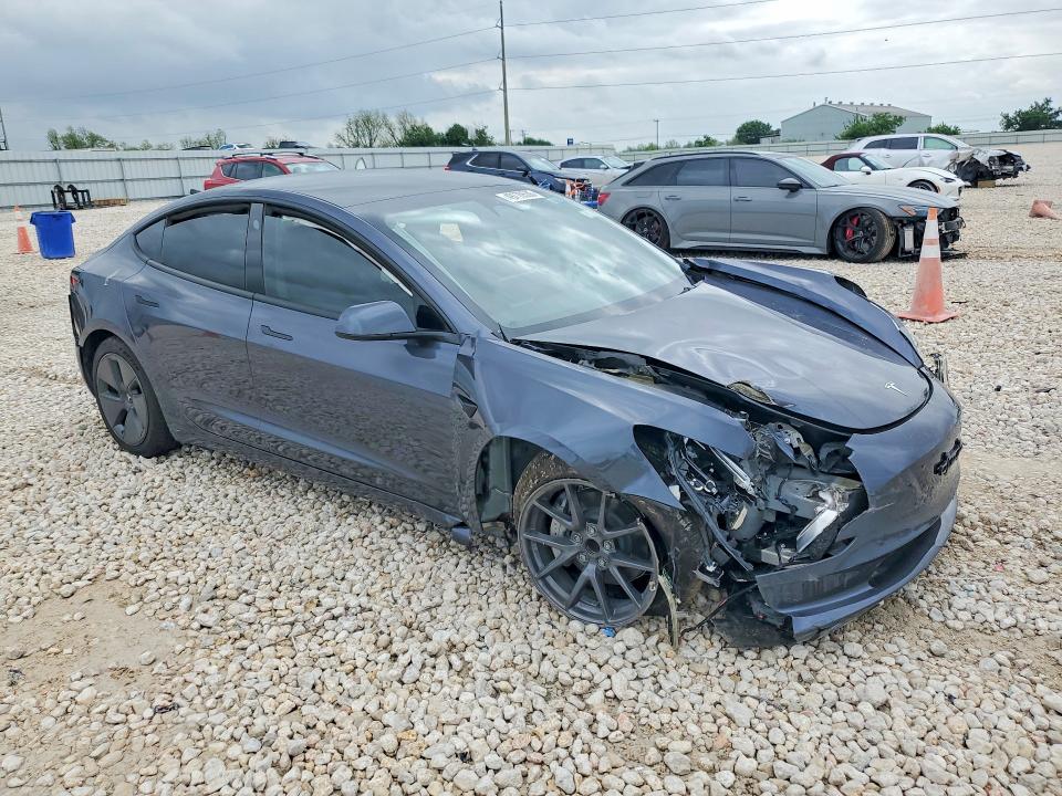 2023 Tesla Model 3 VIN 5YJ3E1EA4PF695178 COPART salvage auction — SIDE, TX - SALVAGE VEHICLE TITLE, sold $3,450 on 2026-07-02 (photo 4)