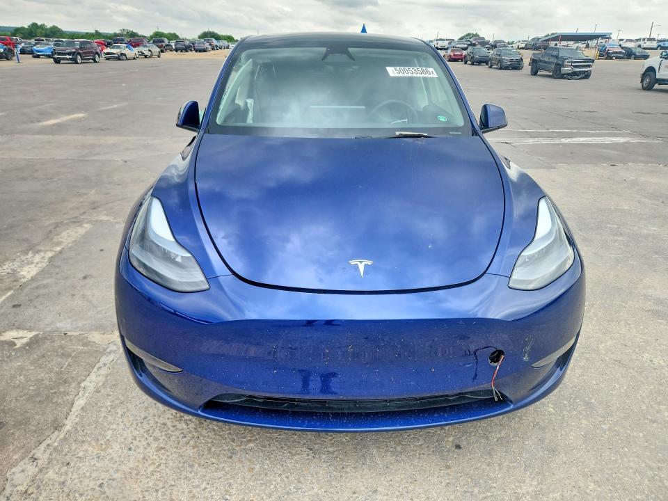 2024 Tesla Model y VIN 7SAYGDEE8RF201611 COPART salvage auction — SIDE, TX - SALVAGE VEHICLE TITLE, sold $12,000 on 2026-07-23 (photo 5)