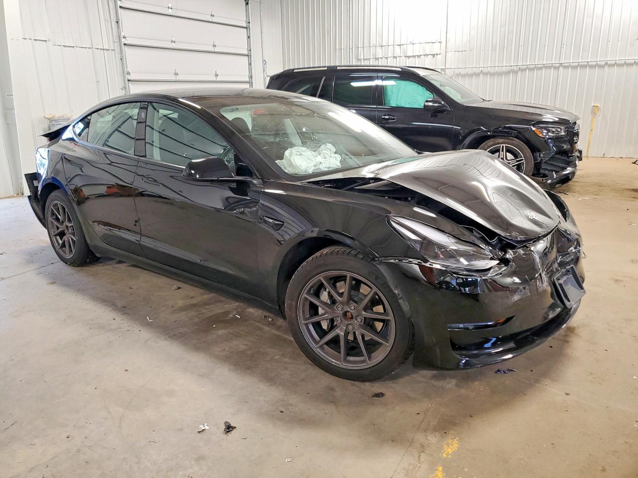 2023 Tesla Model 3 VIN 5YJ3E1EB7PF591423 COPART salvage auction — Rear End, MN - CERT OF TITLE-SALVAGE, sold $3,350 on 2026-05-28 (photo 4)