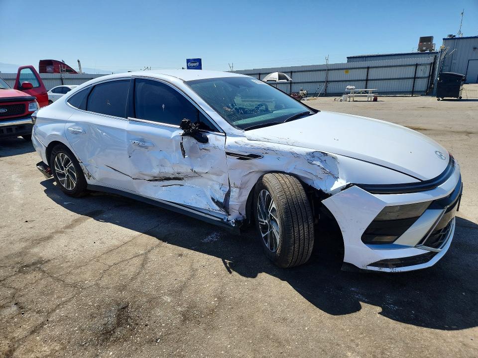 2026 Hyundai Sonata VIN KMHL24JJ2TA151955 COPART salvage auction — SIDE, Salvage Title, sold $7,200 on 2026-07-10 (photo 4)