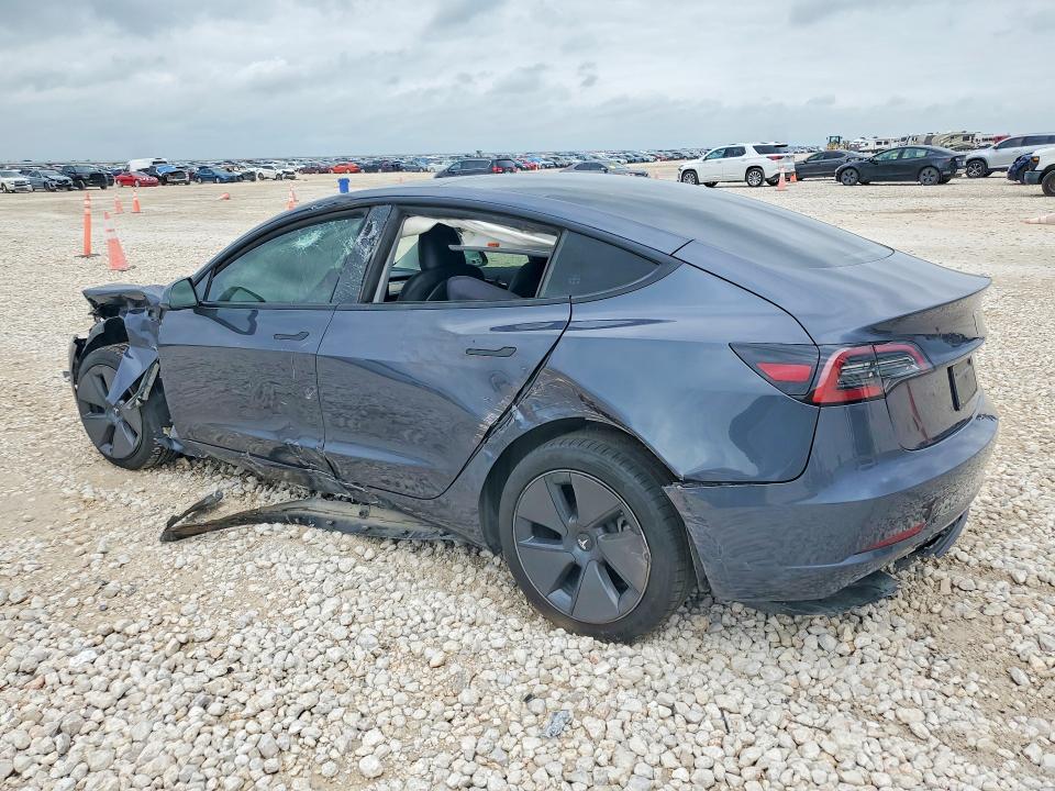 2023 Tesla Model 3 VIN 5YJ3E1EA4PF695178 COPART salvage auction — SIDE, TX - SALVAGE VEHICLE TITLE, sold $3,450 on 2026-07-02 (photo 2)