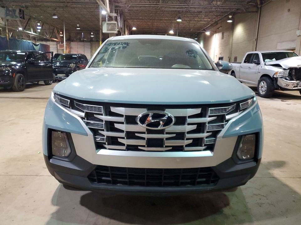 2024 Hyundai Santa cruz VIN 5NTJBDDE1RH111427 COPART salvage auction — SIDE, MI - CERT OF TITLE-SALVAGE VEHICLE, sold $8,600 on 2026-07-10 (photo 5)