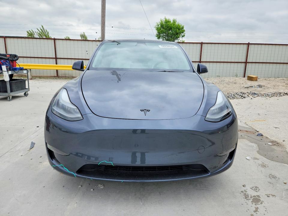 2023 Tesla Model y VIN 7SAYGDEF6PF620921 COPART salvage auction — FRONT END, Tx - Certificate Of Title, sold $5,100 on 2026-07-17 (photo 5)