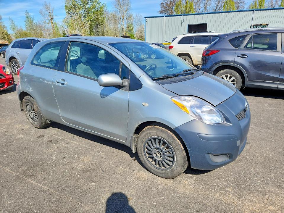 2011 Toyota Yaris VIN JTDJT4K33B5333051 COPART salvage auction — SIDE, Or - Salvage Title Certificate, sold $225 on 2026-07-06 (photo 4)