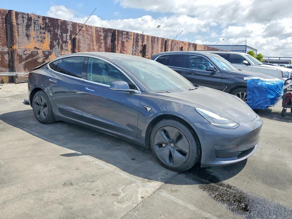 2019 Tesla Model 3 VIN 5YJ3E1EAXKF396366 COPART salvage auction — REAR END, CA - SALVAGE CERTIFICATE, sold $5,700 on 2026-07-29 (photo 4)