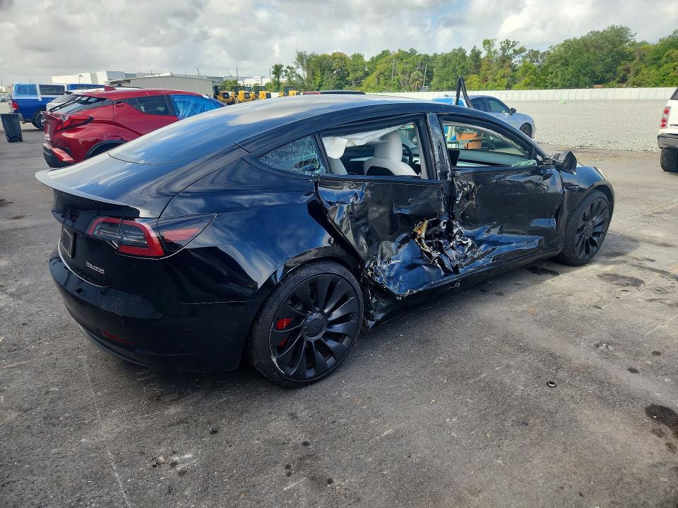 2023 Tesla Model 3 VIN 5YJ3E1EC2PF582671 COPART salvage auction — SIDE, FL, sold $7,900 on 2026-07-27 (photo 3)