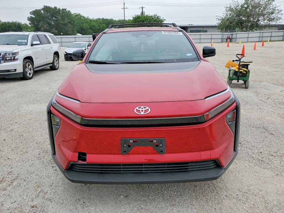 2026 Toyota Bz4x VIN JTMBFAEB1TA004001 COPART salvage auction — SIDE, Tx - Salvage Vehicle Title, sold $6,700 on 2026-07-16 (photo 5)