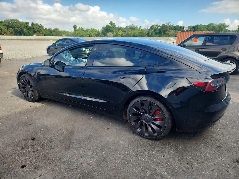 2023 Tesla Model 3 VIN 5YJ3E1EC2PF582671 COPART salvage auction — SIDE, FL, sold $7,900 on 2026-07-27 (photo 2)