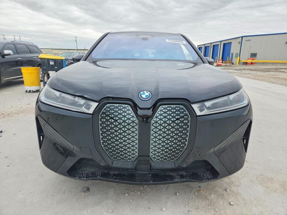 2025 BMW Ix VIN WB533CF00SCT39190 COPART salvage auction — SIDE, Tx - Certificate Of Title, sold $28,250 on 2026-07-28 (photo 5)