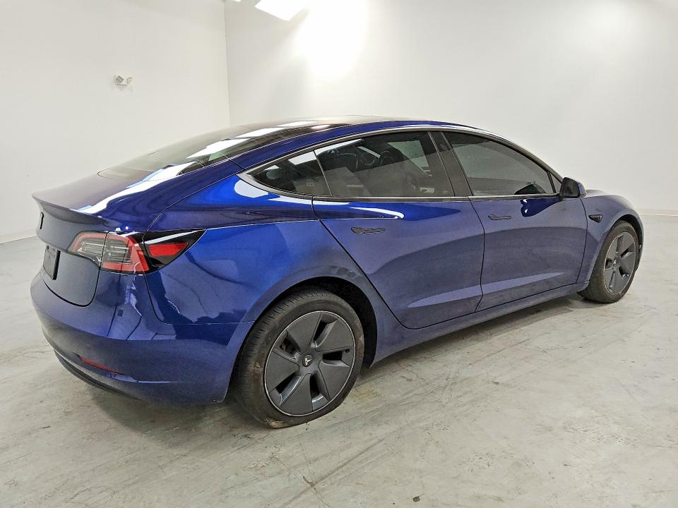 2023 Tesla Model 3 VIN 5YJ3E1EA9PF665190 COPART salvage auction — SIDE, IN - CERTIFICATE OF TITLE, sold $9,000 on 2026-07-23 (photo 3)