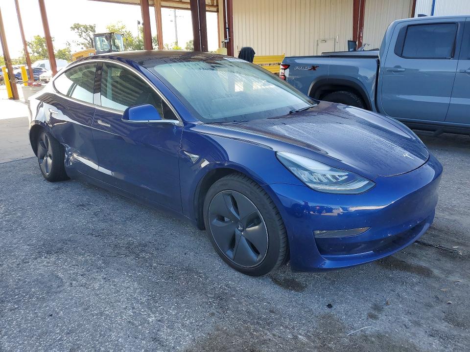 2020 Tesla Model 3 VIN 5YJ3E1EB9LF803104 COPART salvage auction — SIDE, FL, sold $3,750 on 2026-07-24 (photo 4)