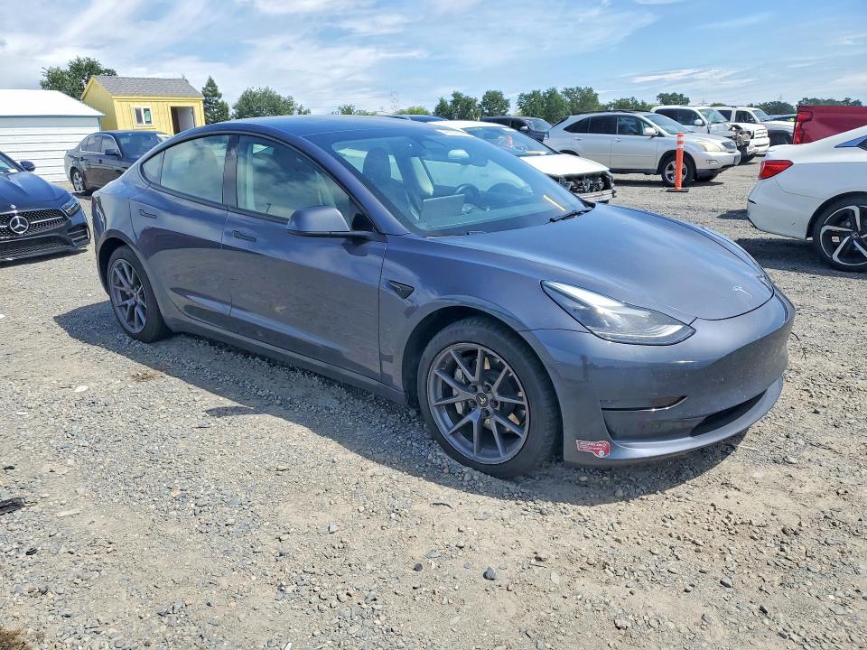 2023 Tesla Model 3 VIN 5YJ3E1EA9PF590524 COPART salvage auction — SIDE, Ca - Salvage Certificate, sold $8,700 on 2026-09-01 (photo 4)