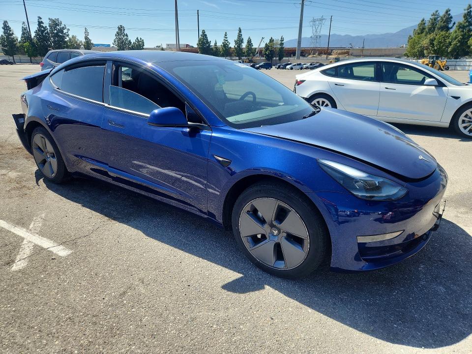 2023 Tesla Model 3 VIN 5YJ3E1EA6PF463312 COPART salvage auction — REAR END, Ca - Salvage Certificate, sold $4,400 on 2026-07-02 (photo 4)