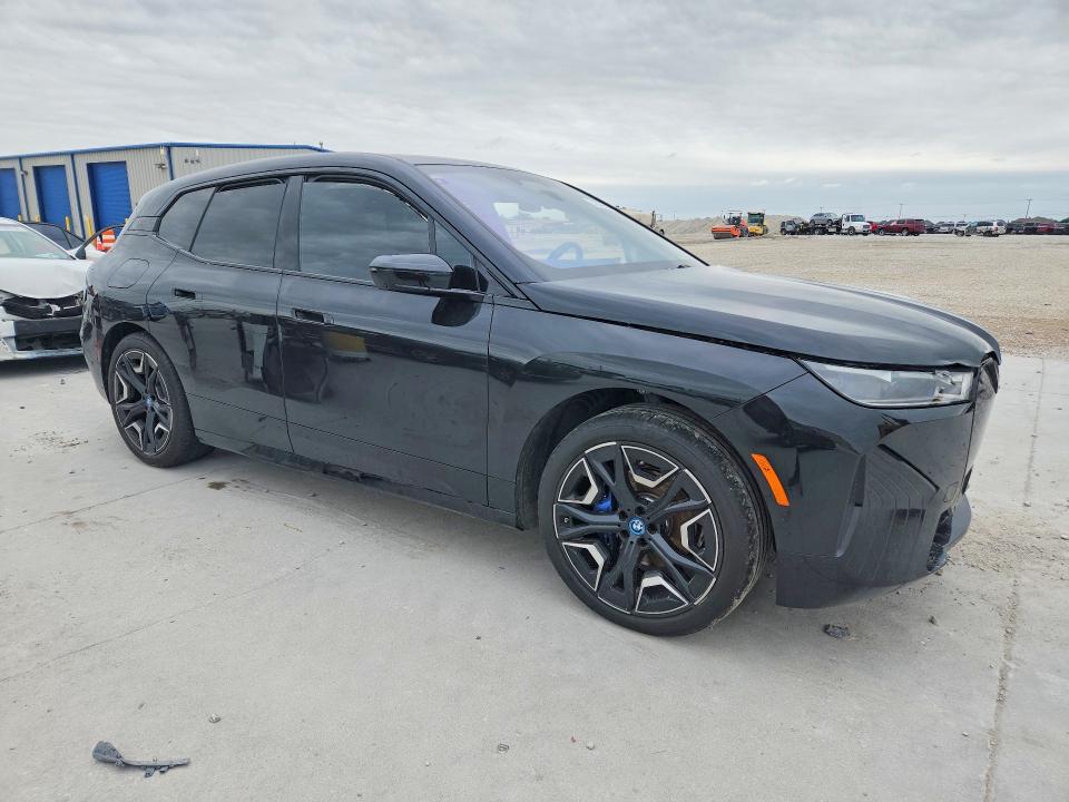 2025 BMW Ix VIN WB533CF00SCT39190 COPART salvage auction — SIDE, Tx - Certificate Of Title, sold $28,250 on 2026-07-28 (photo 4)