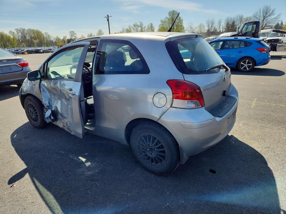 2011 Toyota Yaris VIN JTDJT4K33B5333051 COPART salvage auction — SIDE, Or - Salvage Title Certificate, sold $225 on 2026-07-06 (photo 2)