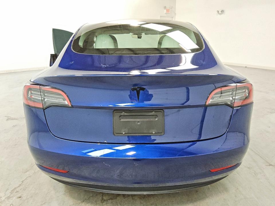 2023 Tesla Model 3 VIN 5YJ3E1EA9PF665190 COPART salvage auction — SIDE, IN - CERTIFICATE OF TITLE, sold $9,000 on 2026-07-23 (photo 6)