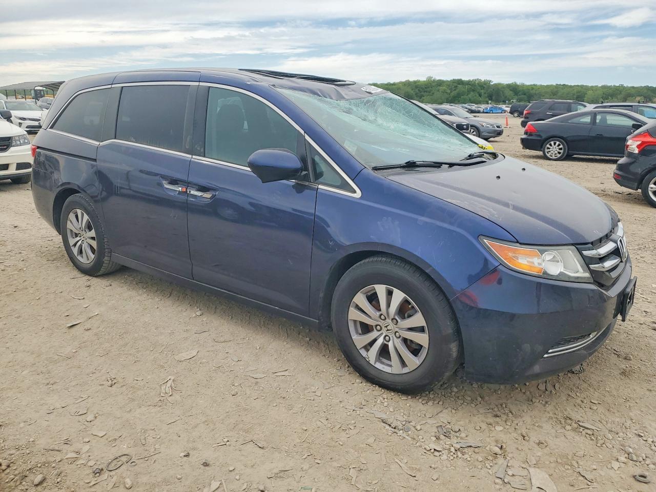 2014 Honda Odyssey VIN 5FNRL5H68EB035799 COPART salvage auction — Top/Roof, TX - SALVAGE VEHICLE TITLE, sold $1,550 on 2026-07-07 (photo 4)